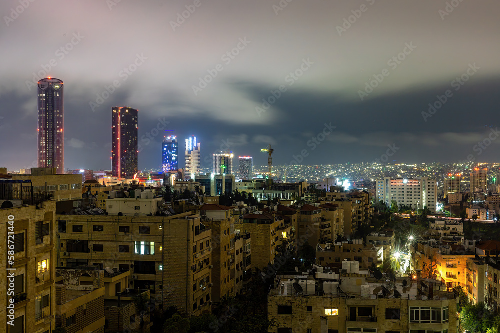 Fototapeta premium Amman, Jordan The skyline of the city at night.