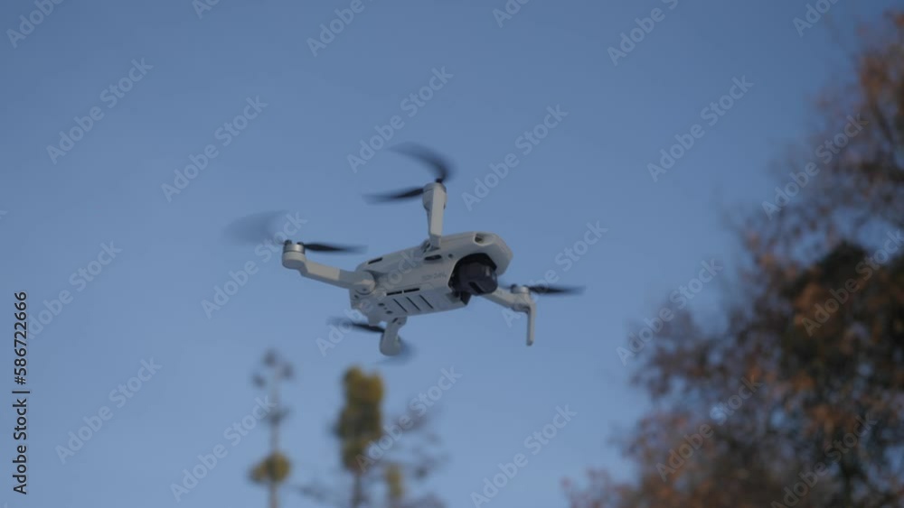 Mini drone is flying in the air Mini drone is flying in the air