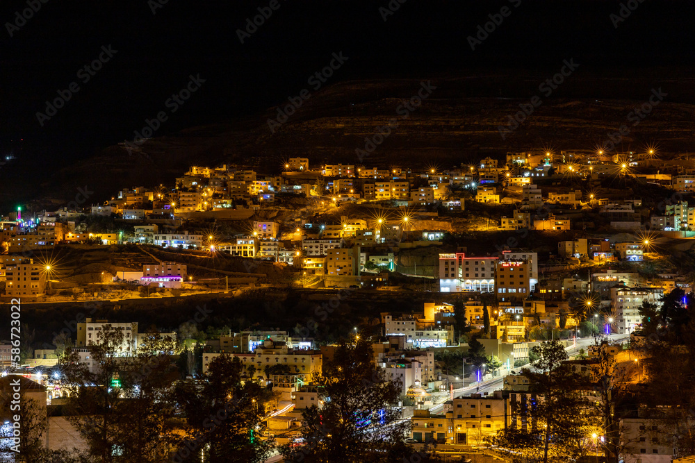 Wadi Musa, Jordan A night view of the city of Petra in the hills.