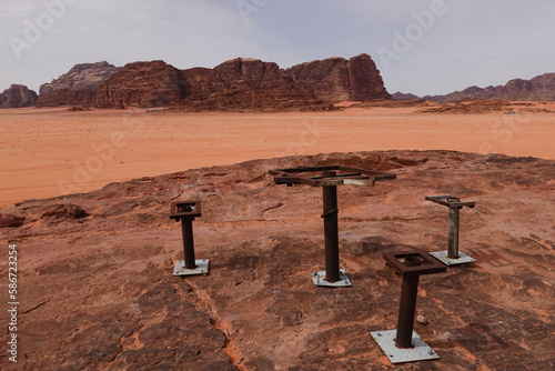 Wadi Rum, Jordan An old decrepit picnic area with table and chairs on a desert rock. photo