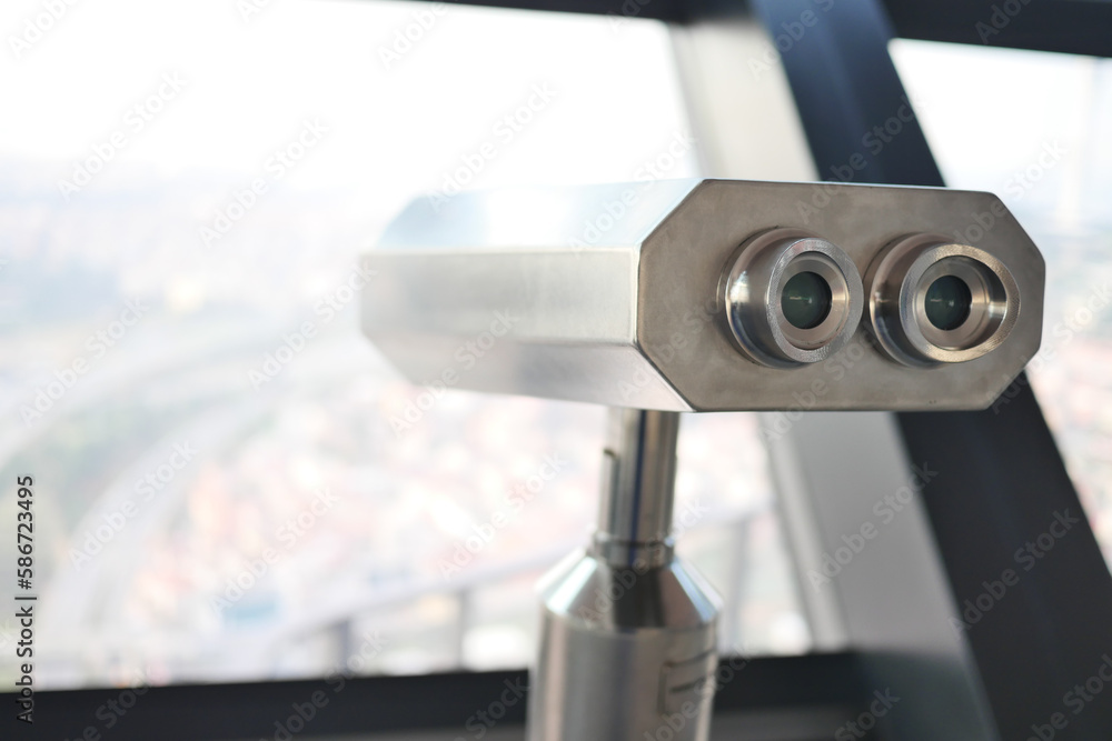 Coin-operated binoculars looking out over city , Coin-operated binoculars looking out over city ,
