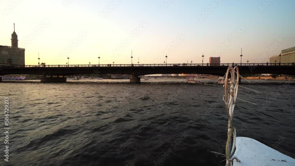 Cairo skyline at sunset, Egypt. View from a sailing boat on the Nile river at sunset, sunrise. Travel and vacation in Egypt Cairo skyline at sunset, Egypt. View from a sailing boat on the Nile river at sunset, sunrise. Travel and vacation in Egypt