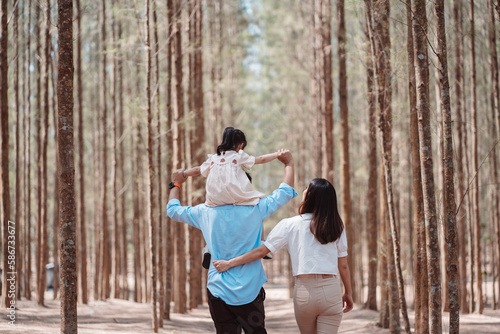 Happy family in the nature travel. family on weekend playing together in the forest.