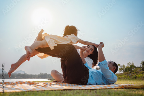 Slika na platnu Happy family in the park on weekend