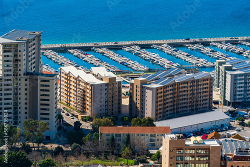 View of a marina in Gibraltar town and Bay of Gibraltar from The Upper Rock. UK
