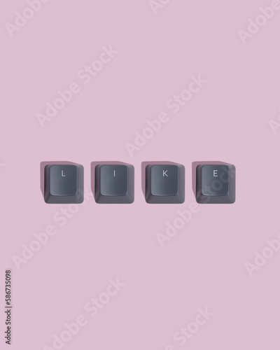 Like - text on keyboard keycap. Pink background. photo