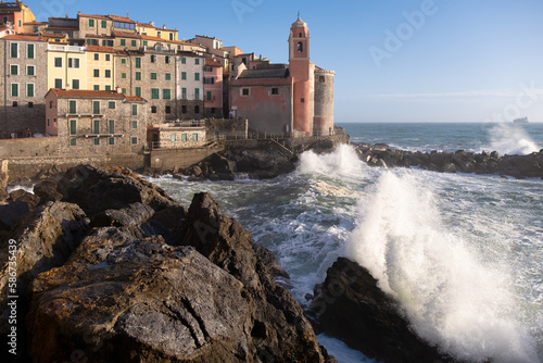 Fototapeta Naklejka Na Ścianę i Meble -  Strong sea waves breaking on Tellaro, ancient and small village near Lerici
