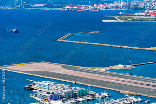 View of the Gibraltar airport runaway and Spanish coast across the Gibraltar Bay from the Upper Rock. UK