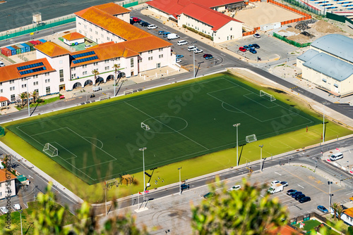 Aerial view of a stadium pitch in Gibraltar town seen from the Upper Rock, UK