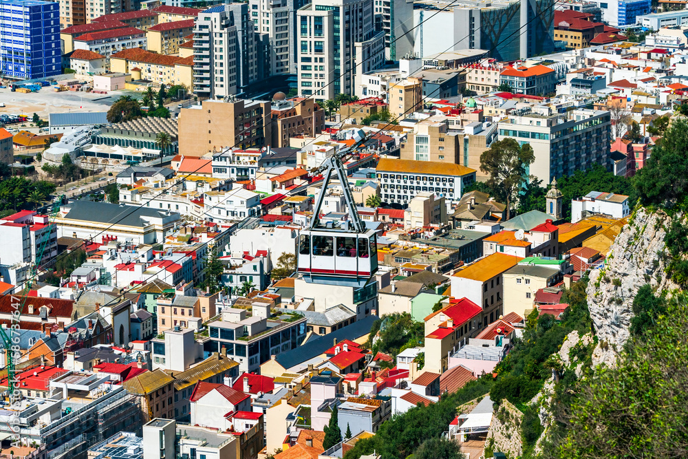 Cable car going up the Gibraltar Rock with Gibraltar town in the background, UK