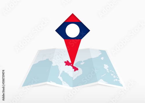 Free Download Laos is depicted on a folded paper map and pinned location marker with flag of Laos. - GFXLoad