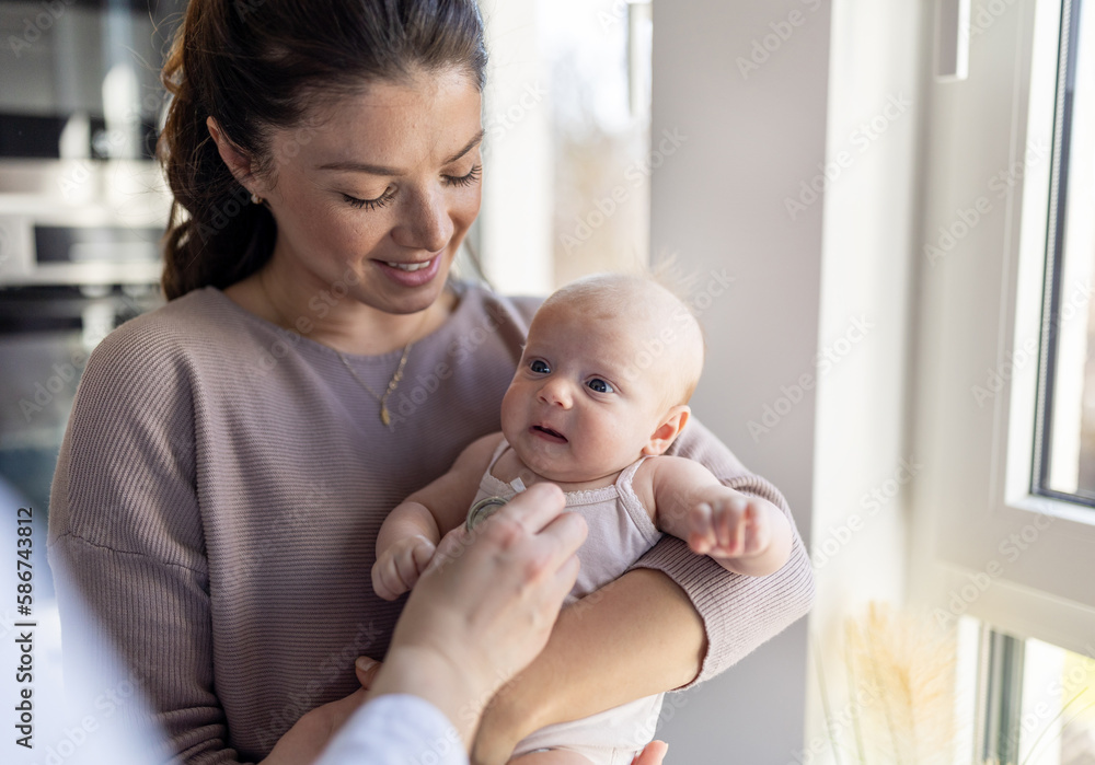 Mother and baby in pediatrician office on checkup Mother and baby in pediatrician office on checkup