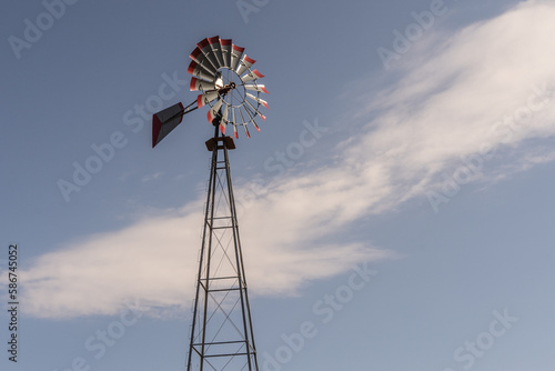 Amish Windmill With a Blue Sky Background