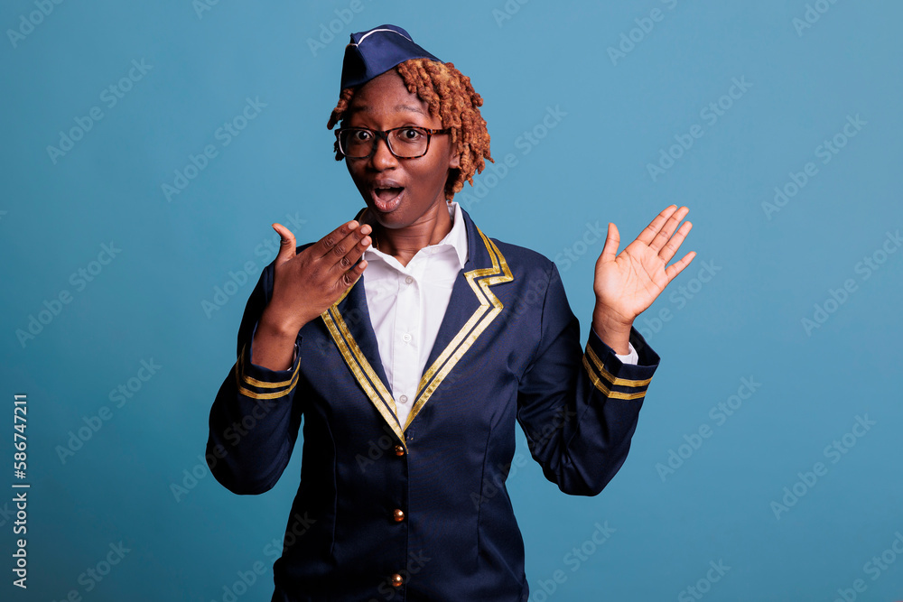 Female flight attendant excited to hear good news and feel surprised in front of the camera. Close up of amazed woman showing a dumbfounded facial expression with her mouth open. Female flight attendant excited to hear good news and feel surprised in front of the camera. Close up of amazed woman showing a dumbfounded facial expression with her mouth open.