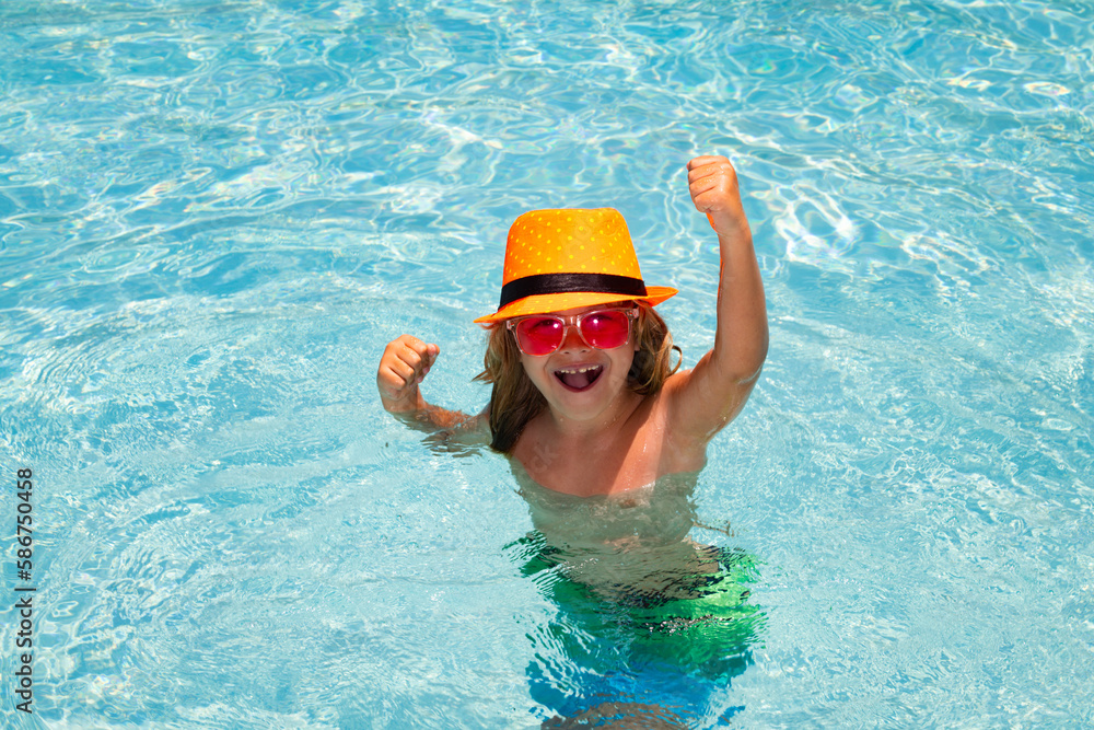 Excited kid boy in pool. Child swimming in water pool. Summer kids activity, watersports.