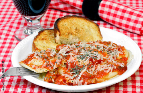 Ravioli dinner with a side of garlic bread.