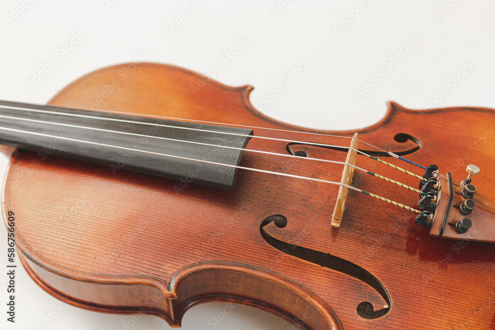 Beautiful Violin Closeup on White Background, Classical, Bluegrass, or Celtic Instrument with Detail Beautiful Violin Closeup on White Background, Classical, Bluegrass, or Celtic Instrument with Detail