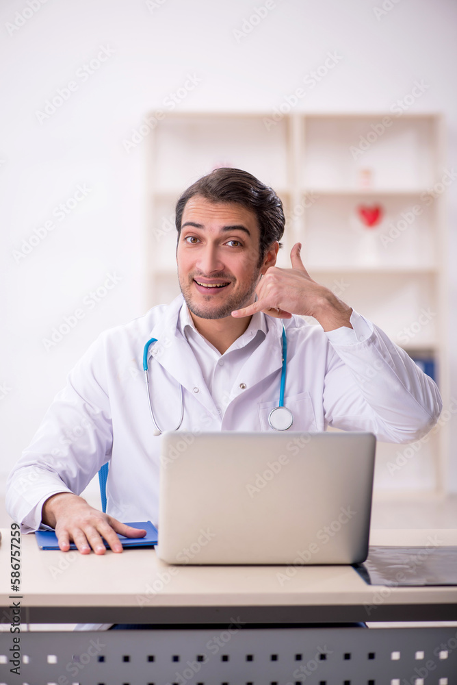 Young male doctor in telemedicine concept Young male doctor in telemedicine concept
