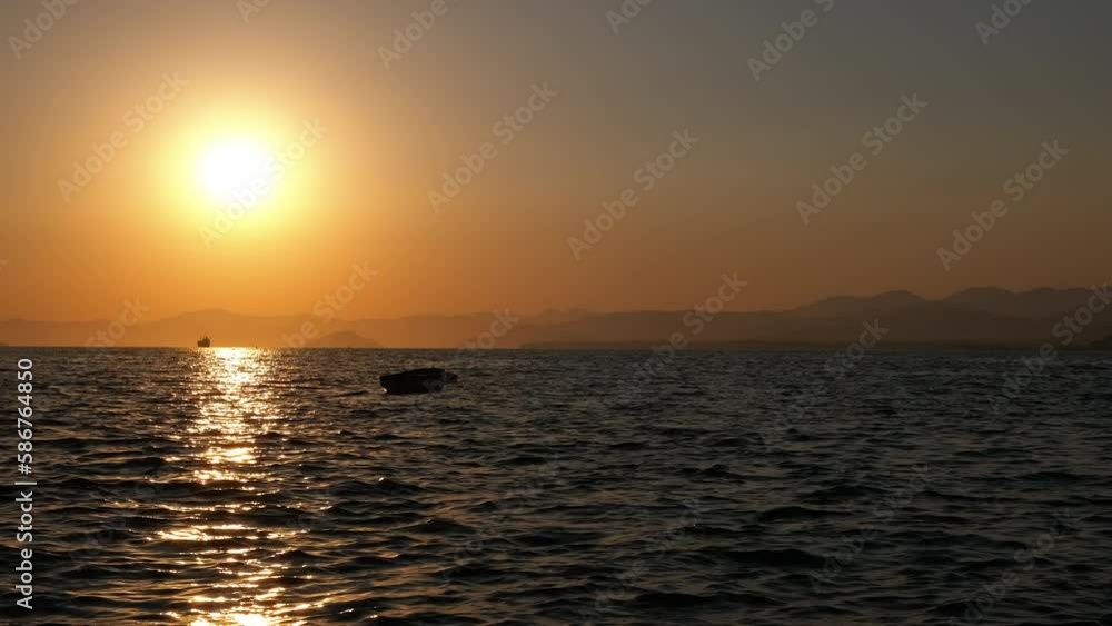 Seascape with sunsets and a boat. Seascape with sunsets and a boat.