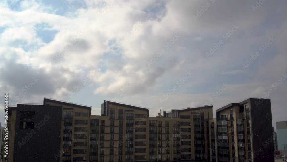 Multi-storey buildings in city in evening with cloudy sky at Summer warm day. Multi-storey buildings in city in evening with cloudy sky at Summer warm day.