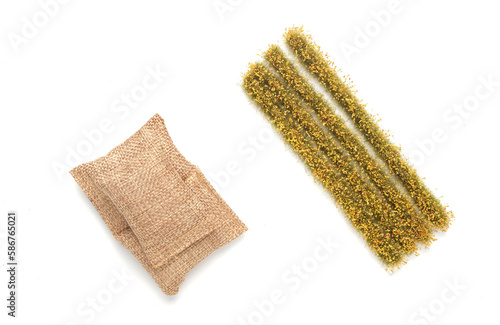 A picture of miniature rice paddy field and rice bags on white background