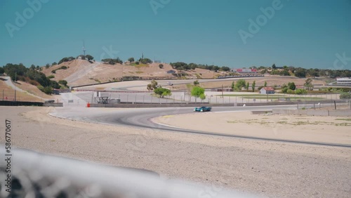Car going around a corner at a track photo