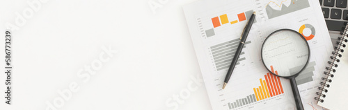 Business graphs, charts, magnifying glass and calculator on table. Financial development, Banking Account, Statistics