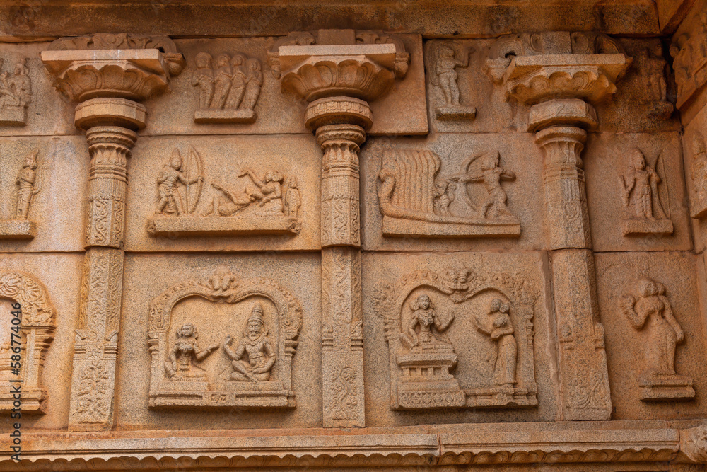 Medieval stone carvings on the walls of Hazara Rama temple built in the early 15th century at Hampi, Karnataka India