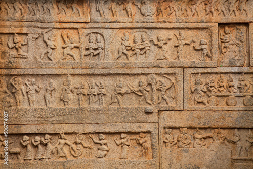 Intricate stone carvings and medieval artwork on the walls of Hazara Rama temple at Hampi, Karnataka, India