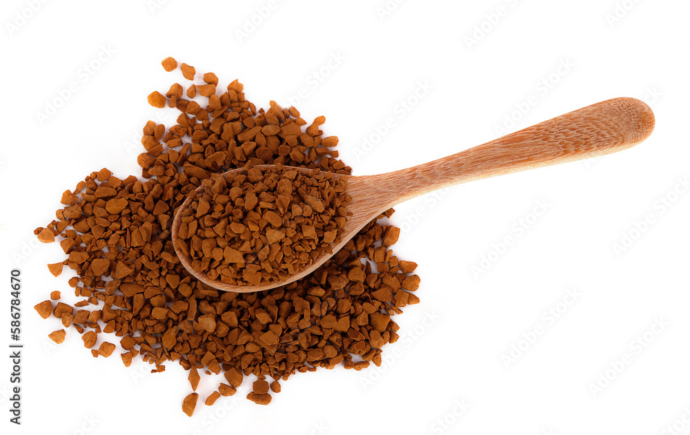 Instant coffee on wooden spoon and scatter on the ground isolated on white background. Instant coffee is a beverage derived from brewed coffee beans that enables people to quickly prepare hot coffee.