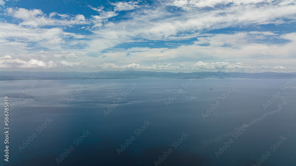 View of Negros Island from the sea. Water cloud horizon background.