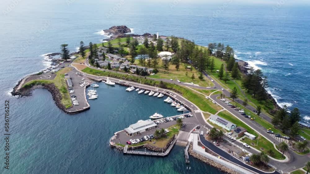 Aerial drone landscape shot of Kiama harbour Robertson Basin bay basin boats docked with roads rocky headland Pacific Ocean coastline Shoalhaven South Coast NSW Australia 4K Aerial drone landscape shot of Kiama harbour Robertson Basin bay basin boats docked with roads rocky headland Pacific Ocean coastline Shoalhaven South Coast NSW Australia 4K