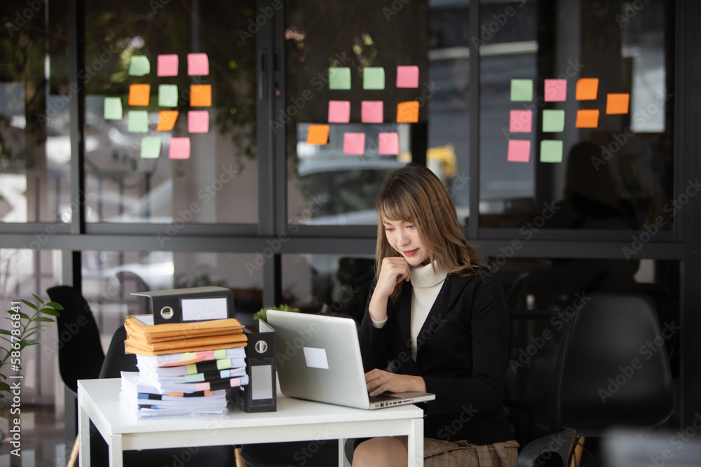 Asian business people sit and look at graphs meeting new projects at the office. Asian business people sit and look at graphs meeting new projects at the office.