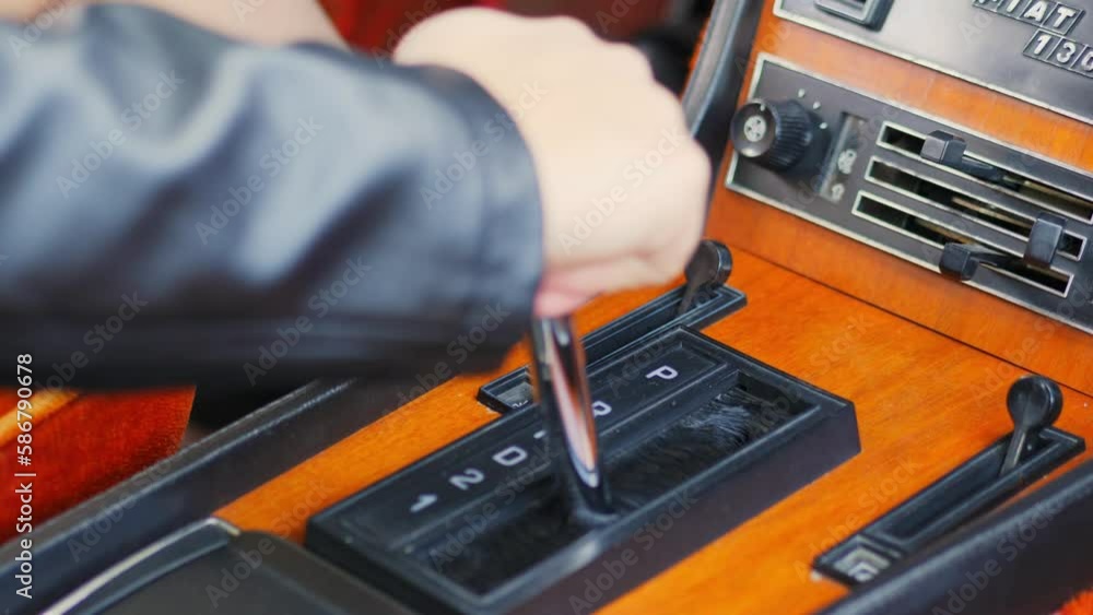 Switching gear to D, classic car, Fiat 130, slow motion 50 fps Switching gear to D, classic car, Fiat 130, slow motion 50 fps