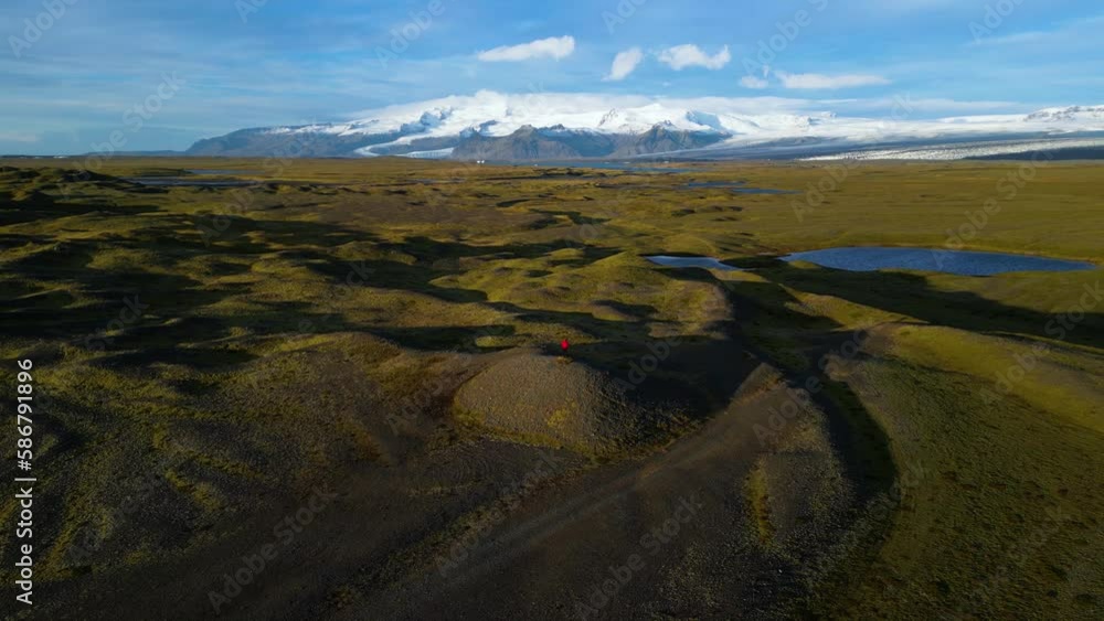 Person Standing in Iceland's Vast Open Wilderness, Aerial Landscape Person Standing in Iceland's Vast Open Wilderness, Aerial Landscape