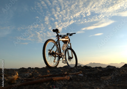 Fototapeta Naklejka Na Ścianę i Meble -  Cycling to the beach in the morning at sunrise