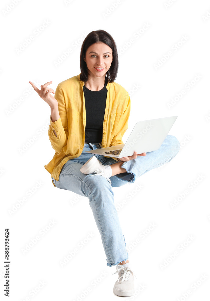 © Pixel-Shot - Pretty young woman with laptop sitting on chair against white background © Pixel-Shot - Pretty young woman with laptop sitting on chair against white background