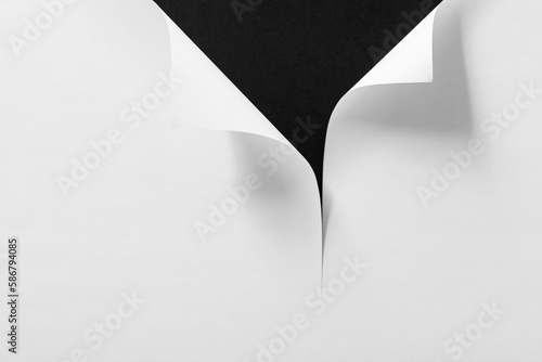 Page curl with shadow on blank sheet of paper.