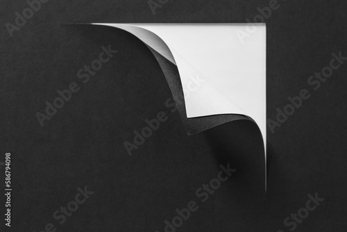 Page curl with shadow on blank sheet of paper.