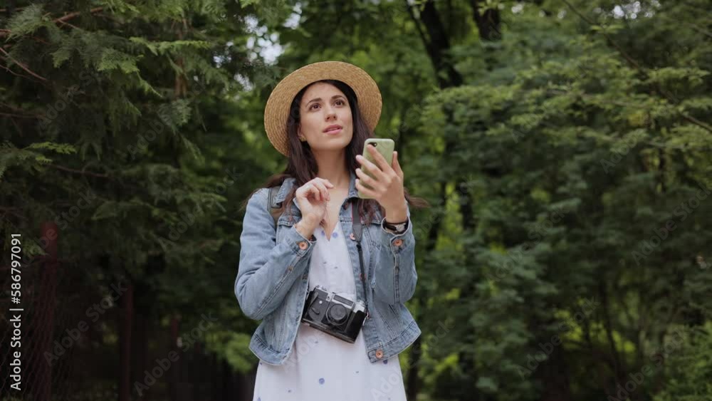 Beautiful hipster adult traveller woman with camera searching destination on traveling trip. Active lifestyle hiking enjoying vacation travel tourism adventure landscape nature. Summer trip concept. Beautiful hipster adult traveller woman with camera searching destination on traveling trip. Active lifestyle hiking enjoying vacation travel tourism adventure landscape nature. Summer trip concept.