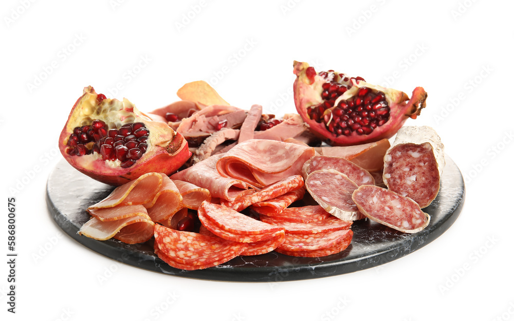 Slate plate with assortment of tasty deli meats isolated on white background