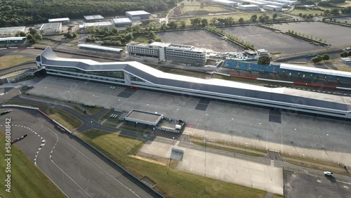 Aerial view circling Silverstone British motorsport international pit straight and race track circuit