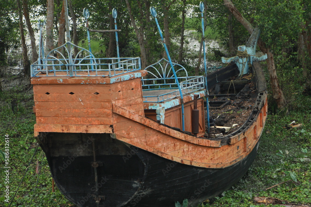 A boat that has been damaged by the storm A boat that has been damaged by the storm