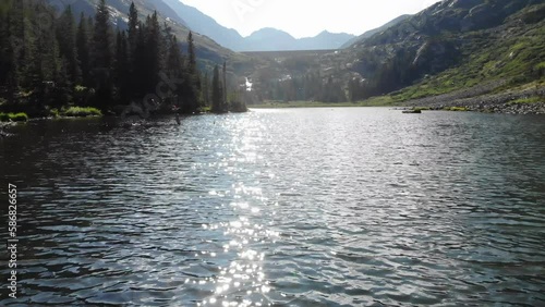 Blue Lake near Breckenridge, Colorado, with Pyramid Peak in the distance. Aerial 4K drone video in the Rocky Mountains.