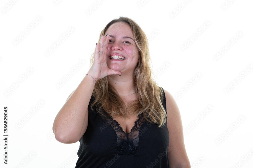 Portrait woman shouting young woman screams and speaks loudly with her hand in amplifier on white background Portrait woman shouting young woman screams and speaks loudly with her hand in amplifier on white background