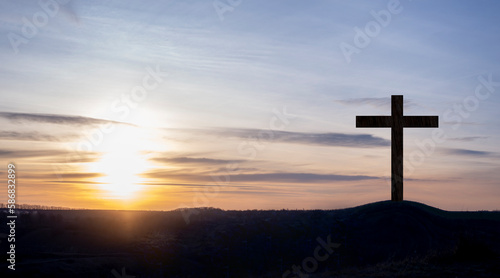 Cross. Crucifixion on the mountain on the background of the sunset sky. Forgiveness of sins and repentance. God's love. The death of Jesus © amdre100