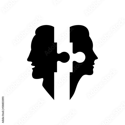Two silhouettes of the head of a man and a woman with a puzzle.