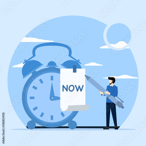 timekeeping concept, businessman with pencil after he wrote the word Now on a note and stuck it on a ringing alarm clock. Stop procrastinating, do it now to finish work or appointments on time.