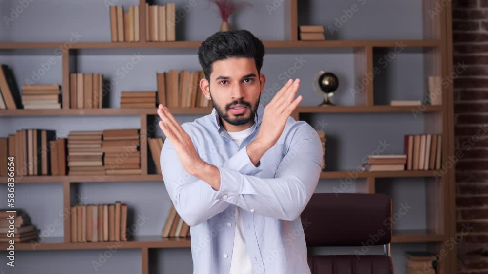 Vidéo Stock Indian man in a blue shirt making a stop or don't do it
