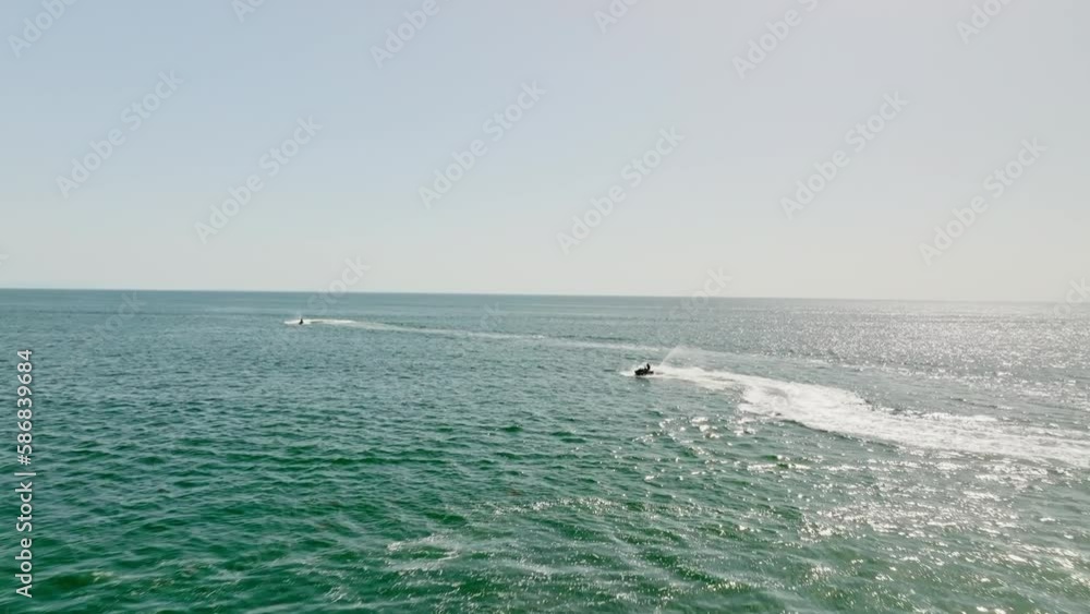 Drone shot flying past two jet skis on coast of Venice Beach, America Drone shot flying past two jet skis on coast of Venice Beach, America